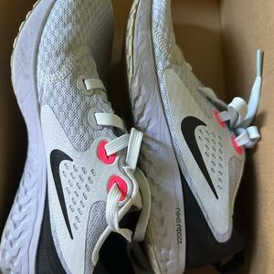 Nike woman’s White/Gray React Running Shoes with Pink Accents